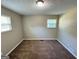 Comfortable bedroom with neutral carpeting and two windows for natural light at 3859 Rosedale Ln, Douglasville, GA 30135