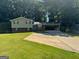 Charming two-story home with brick accents, attached carport, and a spacious front yard at 3859 Rosedale Ln, Douglasville, GA 30135