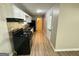 Functional kitchen featuring black appliances, white cabinets, and laminate countertops at 3859 Rosedale Ln, Douglasville, GA 30135