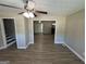 Inviting living room showcasing an open layout and wood-look floors, with views into the kitchen area at 3859 Rosedale Ln, Douglasville, GA 30135