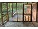 Screened porch featuring a railing and an outdoor bench at 3859 Rosedale Ln, Douglasville, GA 30135