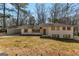 Charming brick home featuring a spacious carport and complementary shutters at 2598 Lake Shore, College Park, GA 30337