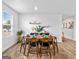 Staged dining room featuring wood floors, decor and natural light at 1653 Sungrown Way, Mcdonough, GA 30253