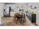Bright dining area featuring wood floors and modern decor at 1653 Sungrown Way, Mcdonough, GA 30253