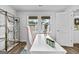 Close up of staged flex room featuring a white desk and a view to the outside at 1653 Sungrown Way, Mcdonough, GA 30253