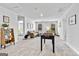 Spacious game room complete with foosball table, comfortable seating, and ample lighting at 1653 Sungrown Way, Mcdonough, GA 30253