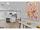 Open-concept kitchen featuring an island and modern appliances at 1653 Sungrown Way, Mcdonough, GA 30253