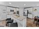 Spacious kitchen boasts a large island with seating and stainless steel appliances at 1653 Sungrown Way, Mcdonough, GA 30253