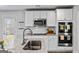 Bright kitchen featuring granite countertops, stainless steel appliances, and a breakfast bar at 1653 Sungrown Way, Mcdonough, GA 30253