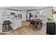 Open kitchen with stainless steel appliances and granite island open to dining area at 1653 Sungrown Way, Mcdonough, GA 30253