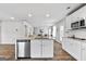 Modern kitchen featuring stainless steel appliances, granite countertops and a stylish island at 1653 Sungrown Way, Mcdonough, GA 30253