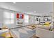 Open-concept living room featuring stylish furnishings, modern fireplace and kitchen access at 1653 Sungrown Way, Mcdonough, GA 30253