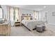 Main bedroom suite with neutral tones, a bed, stylish furniture, and elegant decor at 1653 Sungrown Way, Mcdonough, GA 30253