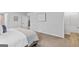 Spacious main bedroom featuring neutral tones, a king bed, and an ensuite bathroom at 1653 Sungrown Way, Mcdonough, GA 30253