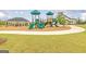 Community playground featuring green slides, climbing structures, and a covered picnic area at 1653 Sungrown Way, Mcdonough, GA 30253
