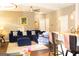 Comfortable living room features a large sectional sofa, neutral walls, and an open-concept design to the kitchen at 7625 Bowhead Ct, Fairburn, GA 30213