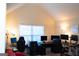 Bright office space with multiple monitors, gaming chairs, neutral carpet floors and a white board at 7625 Bowhead Ct, Fairburn, GA 30213