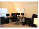 Well-equipped office features multiple monitors, ergonomic seating, neutral carpet floors and white board at 7625 Bowhead Ct, Fairburn, GA 30213