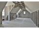 Unfinished attic space with sloped ceilings and natural light offering potential for customization and additional living space at 114 Oak Ridge Dr, Sharpsburg, GA 30277