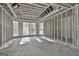 Bright unfinished basement space with exposed beams and natural light ready to be completed at 114 Oak Ridge Dr, Sharpsburg, GA 30277