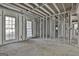 Unfinished basement framed and ready for development, showing abundant natural light at 114 Oak Ridge Dr, Sharpsburg, GA 30277