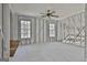 This bedroom has exposed studs and two bright and sunny windows at 114 Oak Ridge Dr, Sharpsburg, GA 30277