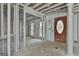 The entryway reveals an open-concept design, showcasing a stained-glass front door, framed by wall studs and bright windows at 114 Oak Ridge Dr, Sharpsburg, GA 30277