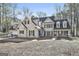 Two-story home with a porch and a driveway offering curb appeal at 114 Oak Ridge Dr, Sharpsburg, GA 30277
