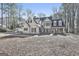 Traditional two story home with symmetrical facade, dormer windows and porch, exuding classic charm at 114 Oak Ridge Dr, Sharpsburg, GA 30277