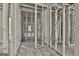 This is a spacious living room with the framing still showing, and large windows at 114 Oak Ridge Dr, Sharpsburg, GA 30277