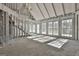 The living room reveals a vaulted ceiling, framed by large windows, offering a sunlit and airy canvas ready for updates at 114 Oak Ridge Dr, Sharpsburg, GA 30277