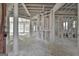 Spacious living room features a large window and natural light, framed by open wall studs awaiting personalization at 114 Oak Ridge Dr, Sharpsburg, GA 30277