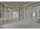 This large living room is under construction, but has bright windows at 114 Oak Ridge Dr, Sharpsburg, GA 30277