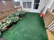 Inviting outdoor deck with a green turf surface, potted plants and garden boxes at 3223 Thornecreek Dr, Douglasville, GA 30135