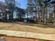 Large backyard featuring mature trees, a shed, and seating at 3223 Thornecreek Dr, Douglasville, GA 30135