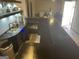 Spacious wet bar in the basement, featuring a sink, cooler, and ample counter space at 3223 Thornecreek Dr, Douglasville, GA 30135