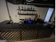 Fully-functional wet bar set up in finished basement with full counter and shelving at 3223 Thornecreek Dr, Douglasville, GA 30135