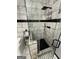 Stand-up shower with matte black hardware and marble-style tiling in modern bathroom at 3223 Thornecreek Dr, Douglasville, GA 30135
