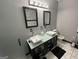 Bathroom featuring dual vessel sinks, vanity, and stylish tile flooring at 3223 Thornecreek Dr, Douglasville, GA 30135