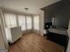 Bedroom with light-filled windows and hardwood floors at 3223 Thornecreek Dr, Douglasville, GA 30135