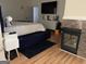Bedroom with fireplace, television, dresser, and plenty of light at 3223 Thornecreek Dr, Douglasville, GA 30135