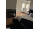 Bright bedroom with a fireplace, dresser, and natural light at 3223 Thornecreek Dr, Douglasville, GA 30135