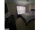 Bedroom featuring purple accents, window, and full sized bed at 3223 Thornecreek Dr, Douglasville, GA 30135