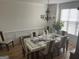 This formal dining area features a glass table and decorative chandelier at 3223 Thornecreek Dr, Douglasville, GA 30135