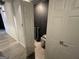 Hallway with a set of white doors leading to another room at 3223 Thornecreek Dr, Douglasville, GA 30135