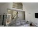 Bright living room featuring a chandelier, staircase, and high ceilings at 3223 Thornecreek Dr, Douglasville, GA 30135