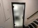 Staircase featuring an obscured glass door at 3223 Thornecreek Dr, Douglasville, GA 30135