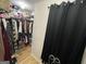 Walk-in closet with plentiful storage for clothing at 3223 Thornecreek Dr, Douglasville, GA 30135