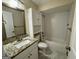 Bathroom features a granite vanity, white subway tile and cabinet for storage at 2270 Titan Ridge Dr, Decatur, GA 30035