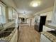 Modern kitchen with stainless steel appliances, white cabinets, and hardwood floors at 2270 Titan Ridge Dr, Decatur, GA 30035